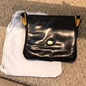 Saks Fifth Avenue black handbag with gold buckles